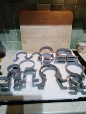 Quantity Of Downspout Brackets, Various Colours, Shapes And Sizes. Guttering.