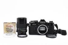 [Near MINT w/Strap] Canon AE-1 Black Camera + NFD 135mm f2.8 Lens From JAPAN