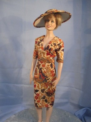 Winnie a doll dress and matching hat for  Princess Diana. Doll not included.