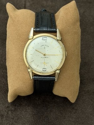 Lord Elgin Men's Manual Wind 23 Jewels Gold Tone Watch Silver Dial Black Strap