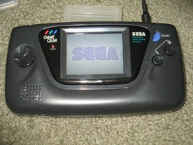 Sega Game Gear Set: Console, TV Tuner, Case, Battery Pack, Power Supply, 2 Games