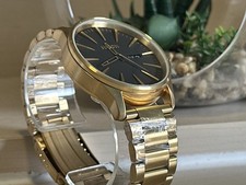 Image of nixon sentry black dial a356-510 gold stainless steel day/date men's 42mm watch
