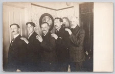 Real Photo Postcard RPPC Group of Men with Hands Shoulders Looking Uncomfortable