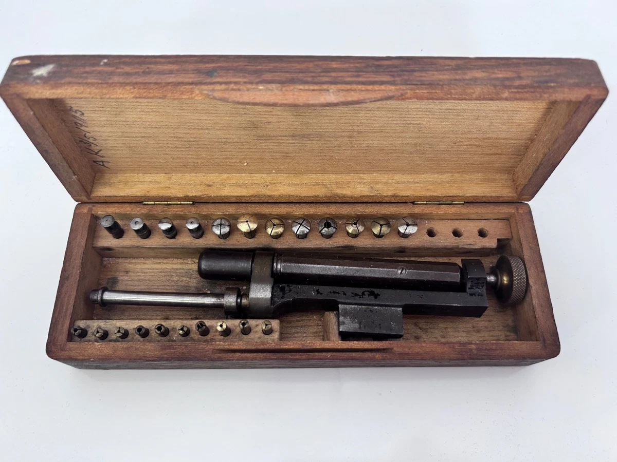 Watchmakers screw head polisher with collets in box.