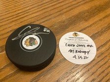 Signed Puck Signed Caleb Jones (CHICAGO BLACKHAWKS) with Team Certification