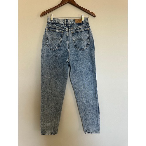 Light blue vintage Lee high-rise mom jeans size 8 with back patch pockets and brown leather Wrangler patch on waistband.