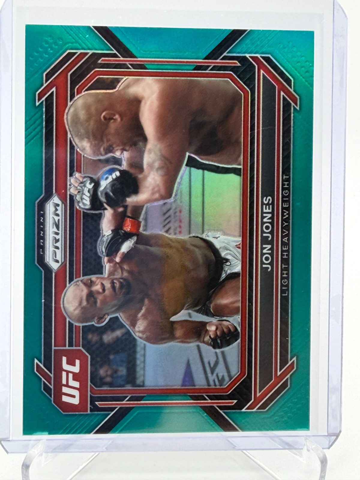 2023 Panini Prizm UFC #74 Jon Jones Teal Prizm /49