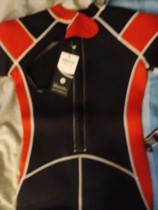 Ireenuo full wet suit size 12. Red, black, and white with tag it was never used.