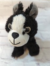 Walmart small plush black white puppy dog brown eyes stitched nose sitting