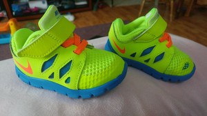 blue and neon yellow nike shoes