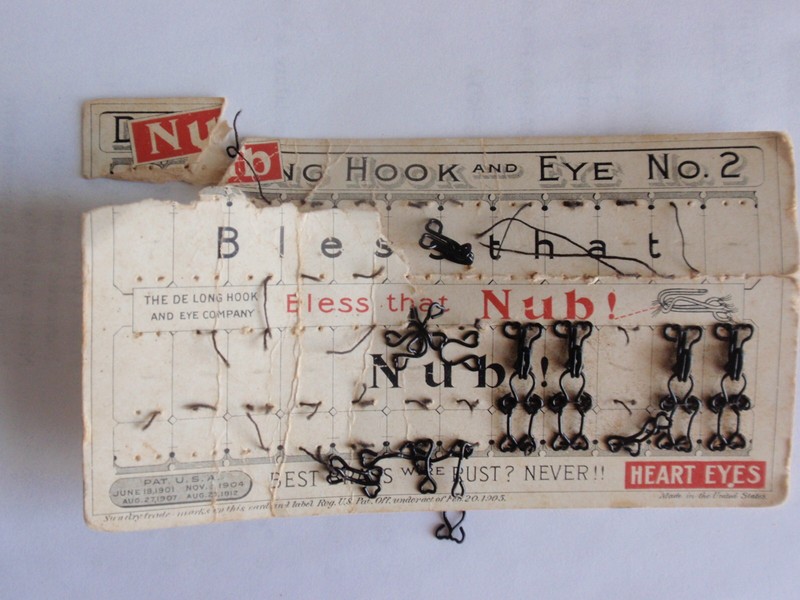 Delong Nub brass wire hook & eye card heart eyes "Bless That Nub!" 1901 - 1912