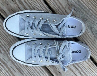 Converse All Star shoe size 6 US women. Has double tongues, and sparkling laces.