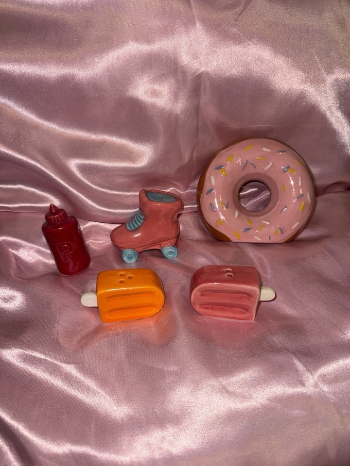 A curated lot of mini retro diner shakers — donut, popsicle, roller skate — that look straight out of a 1950s soda fountain and work as a set.