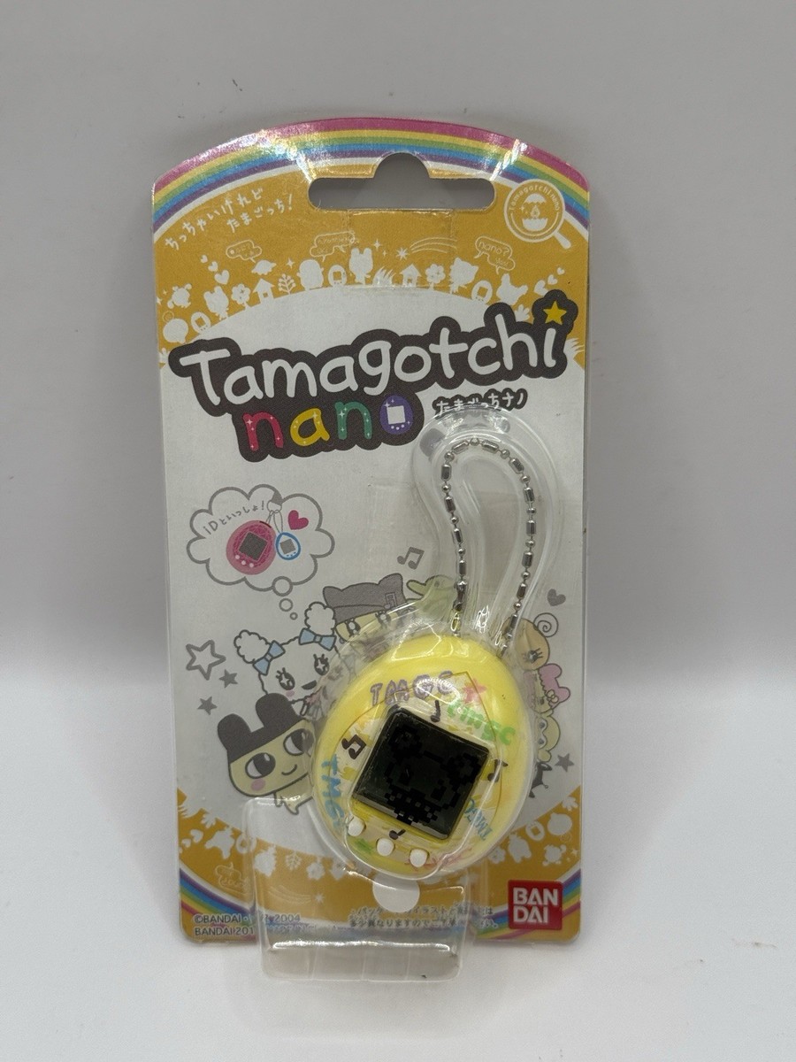 Tamagotchi Nano - Yellow Shell - Wave 1, Oct 2010 - Bandai Virtual