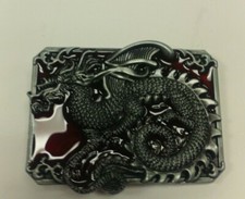 DRAGON BELT BUCKLE PEWTER FINISH RED BACKGROUND APPROX. SIZE 3 IN BY 2 IN
