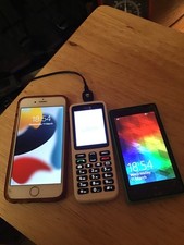 3 old phones and 1 charger, Microsoft Lumia, IPhone 6s, Doro. Untested.