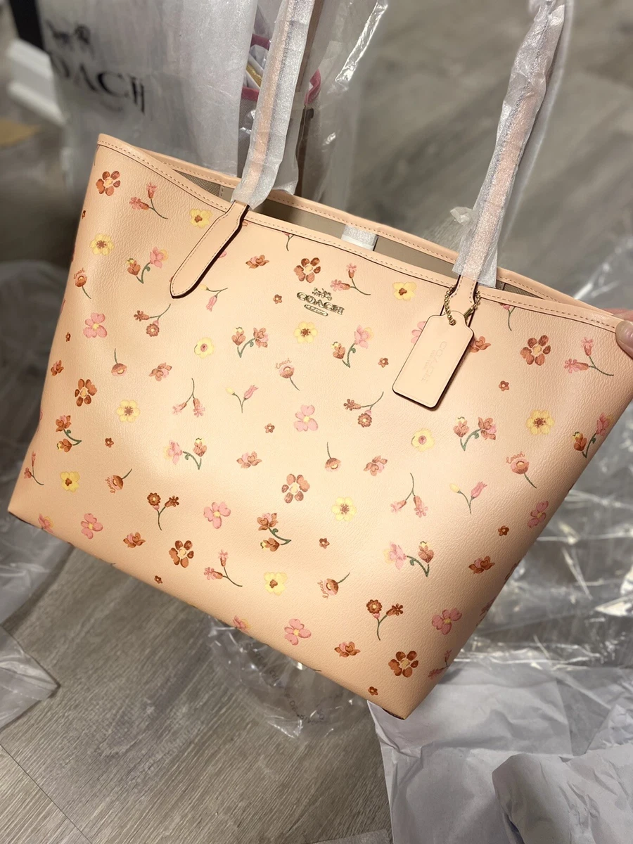 Buy the Coach Pink Signature Pattern Canvas Tote Bag Flower Charm