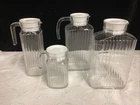 Vintage lot of 4 Ribbed Glass Refrigerator  Bottles w/lids Assorted Sizes