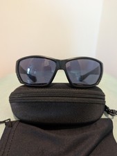 Costa Del Mar Tuna Alley With blacked-out frame and polarized lenses.