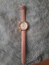 Accutime watch with a pink leather strap and a rose-tone case.watwe Proof Ext. 