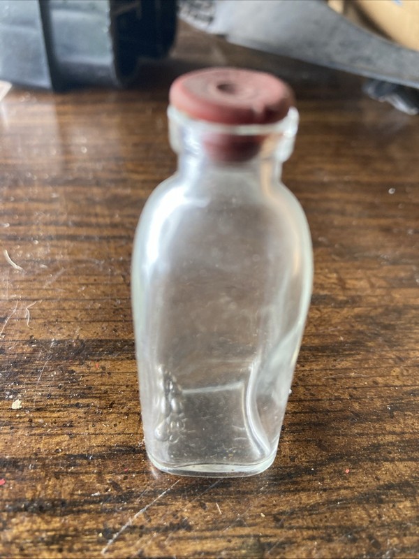 small round 2 1/2 medicine rubber top glass bottle vintage