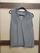 Ladies Sleeveless Denim Blouse, faded as denim is. Soft, dressy ruffled collar.