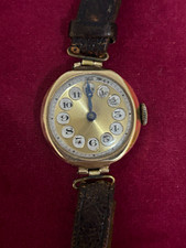 9ct gold 1920’s art deco watch with original leather strap