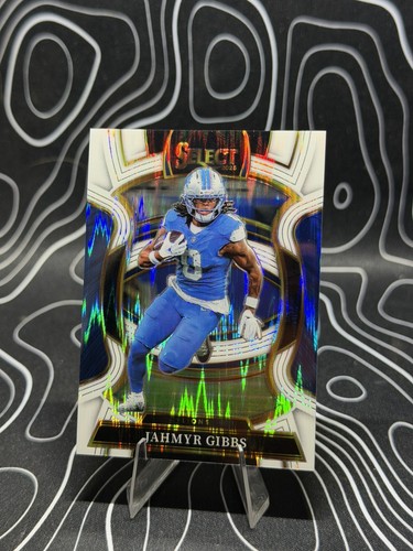 2025 Panini Select Jahmyr Gibbs White Shock Prizm /799 #71 Lions
