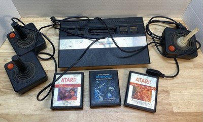 Atari 2600 Console with Games Asteroids ET Raiders of the Lost Ark