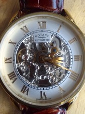 Rotary Men’s Automatic Day/ Date Skeleton Gold plated Case BlackLeather Strap 