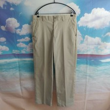 Greg Norman beige polyester Golf Trousers. UK men's size W34 L30