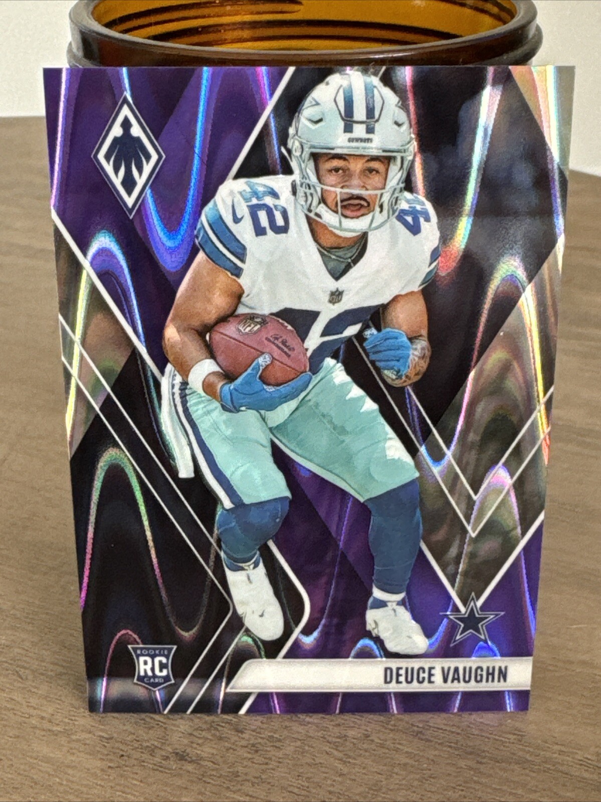 2023 Panini Phoenix - Rookies Purple #134 Deuce Vaughn /125 (RC)