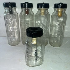 Lot 9 Vintage Glass Baby Bottles, 4 oz 8 oz Embossed Bottles Black Caps Nipples