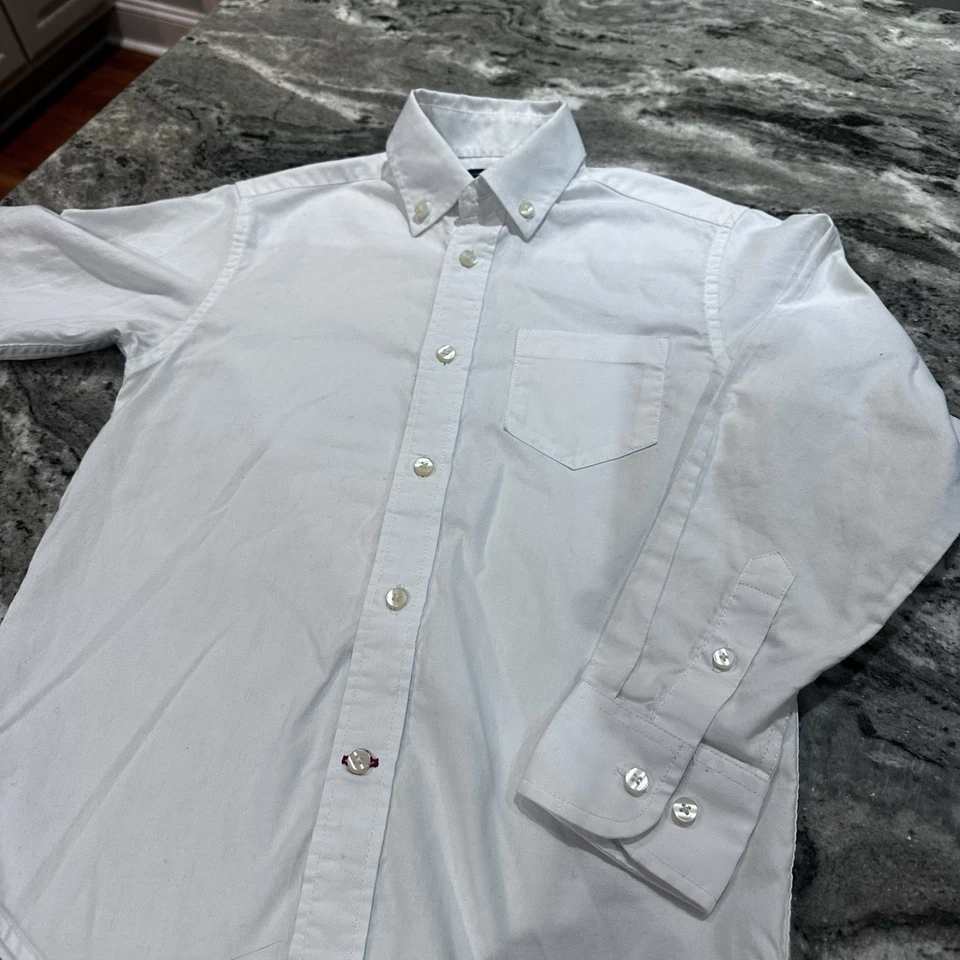 Camisa Tommy Hilfiger manga larga blanca con botones para niños talla 8 Foto 2 de 4