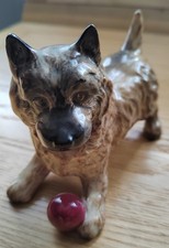 Dog Figurine By Beswick Featuring A Cairn Terrier With Red Ball
