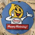 VINTAGE 1962 ESSO GASOLINE HAPPY MOTORING 12 INCH PORCELAIN ENAMEL SIGN