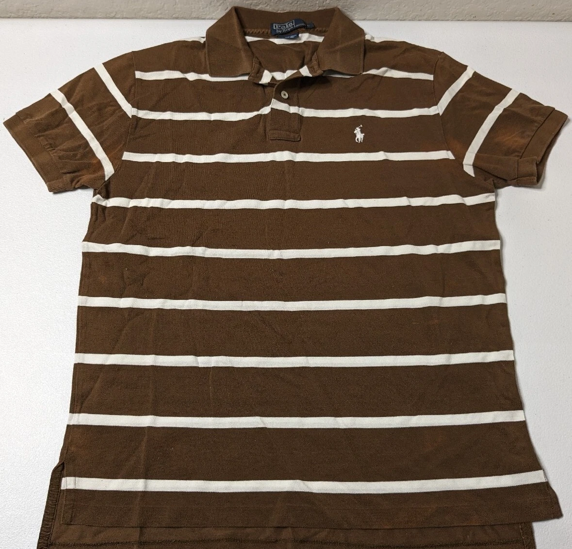 brown and white polo shirt