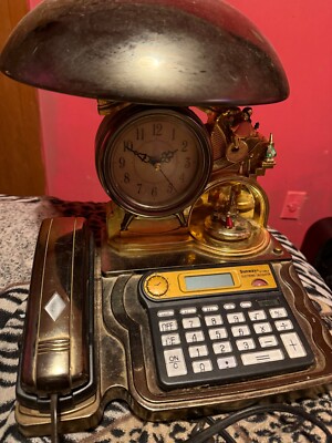 antique calculator/ phone/ clock it s a lot of things in one. Idk If It Works.
