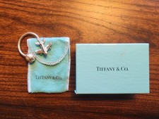 Tiffany Company .825 silver key ring in original packaging. Airplane and Globe