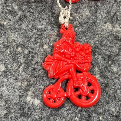 Red Bakelite Girl on Bike Shade Pull - SOLD INDIVIDUALLY