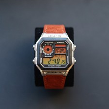 Orologio Illuminatore CASIO AE1200 con Gradiente Colore Tramonto e Cinturino Pelle Marrone