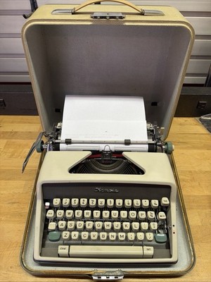 Olympia SM7 Deluxe Portable Typewriter & Case