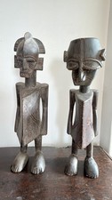 A pair of early African tribal art hand carved painted wooden ancestral figures