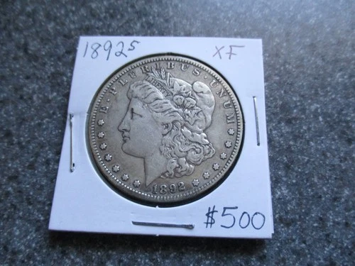 1892's MORGAN SILVER DOLLAR  in VERY NICE VF to  XF  condition. RARE DATE!