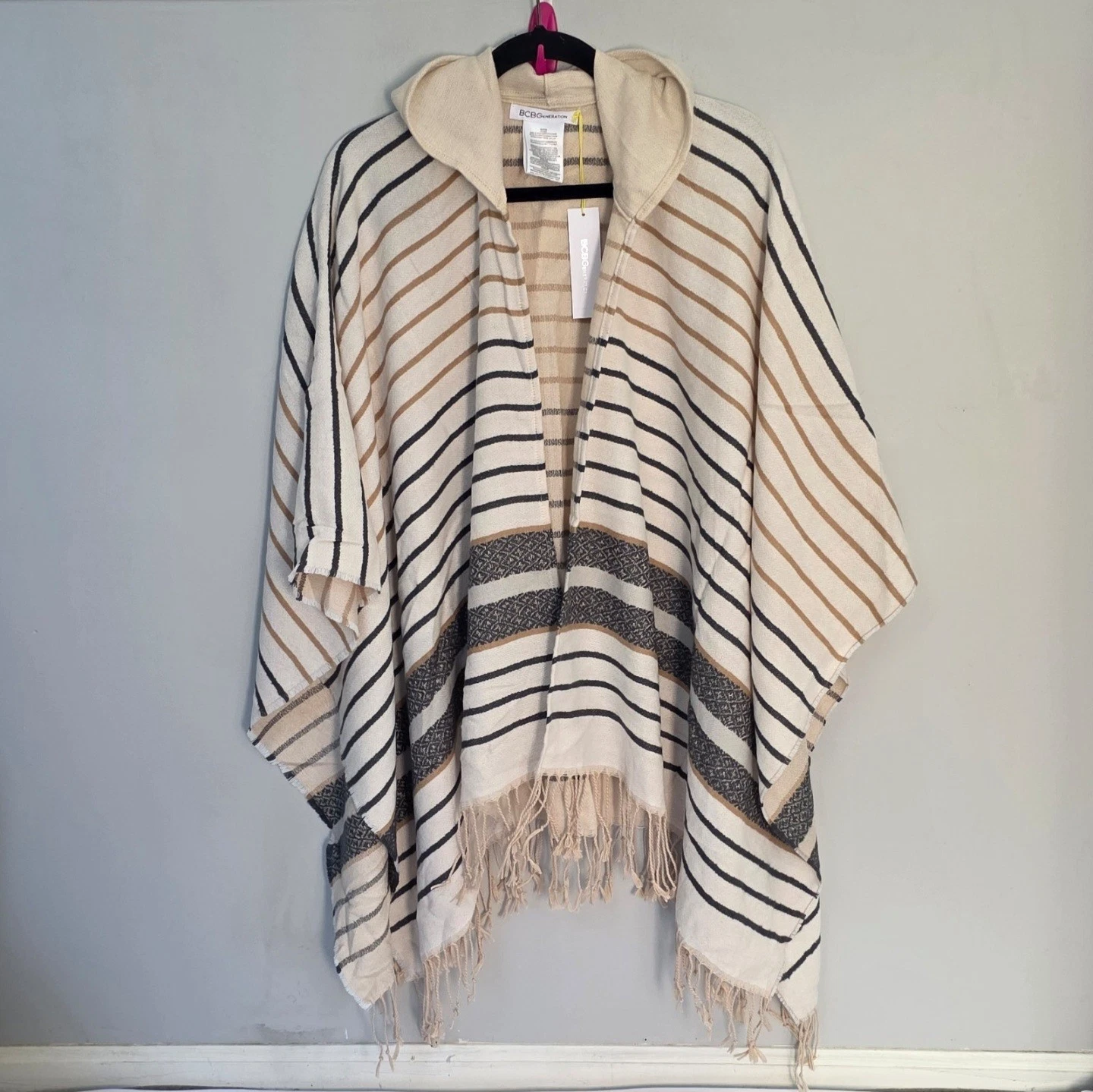 BCBGeneration striped poncho with a hood, fringe trim, and a camel/multi-color