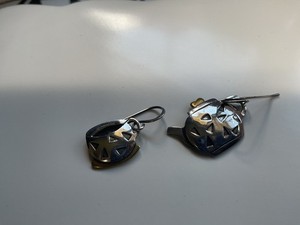 Matching tea pot with teacup silver tone earrings by Far Fetched