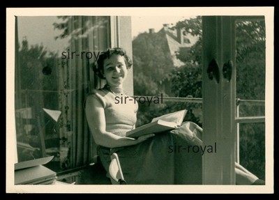 Pretty woman reading a book at the open window - GDR 1950s - photo 10x7cm