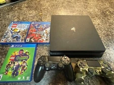 Black Ps4 with 3 games and 2 controllers all used