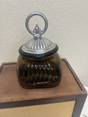 Vintage amber ribbed glass apothecary canister with a pewter lid.  8.5'' tall