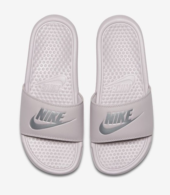 pink and silver nike slides